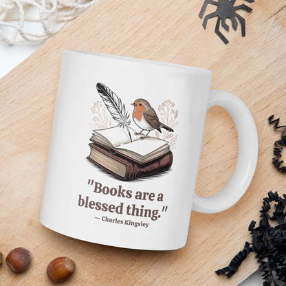 Mug with a bird illustration and quote on a wooden surface