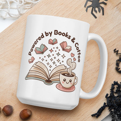 White mug with 'Powered by Books & Coffee' design on a wooden board with nuts and spider decorations.